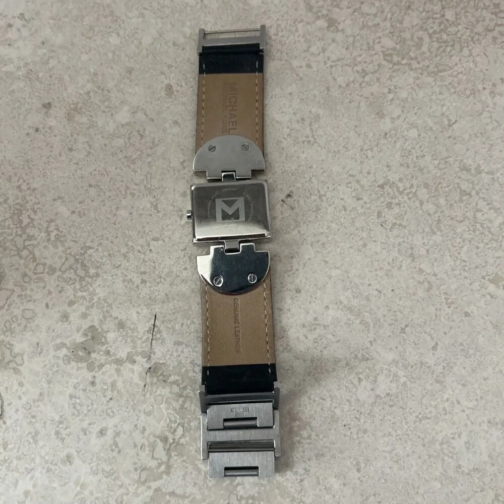 Michael Kors Women’s Rectangle Quartz Watch Silver Dial Black Leather Strap Date